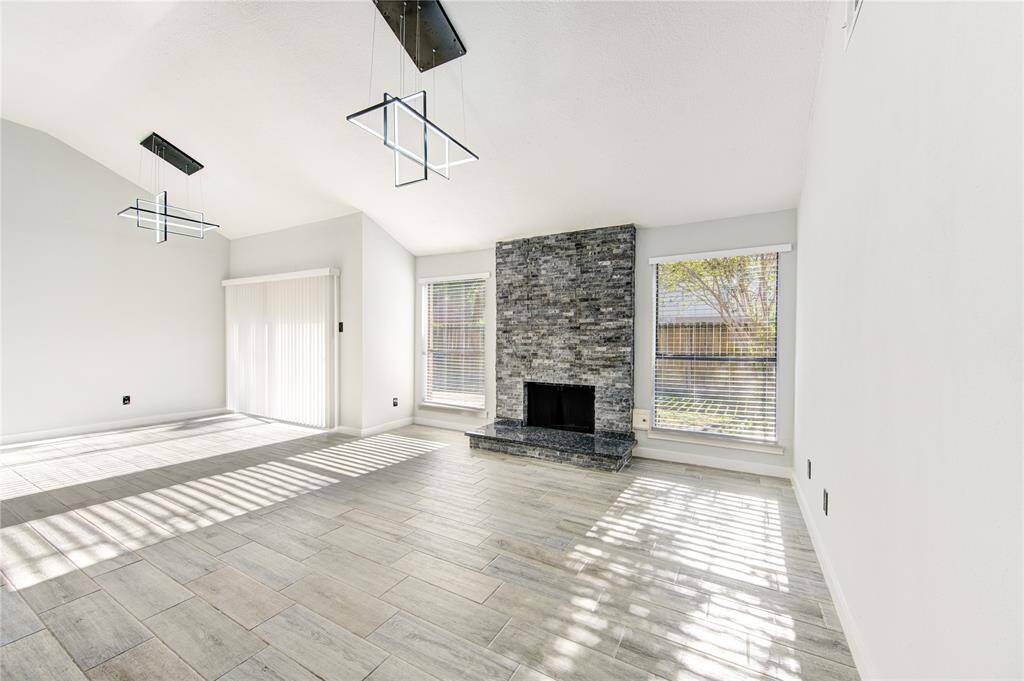 Spacious family room seamlessly connected to the kitchen, perfect for gatherings.