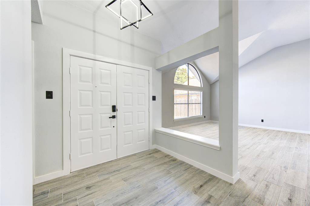 Experience seamless living with this home's inviting open floor plan, featuring a bright and welcoming entrance.