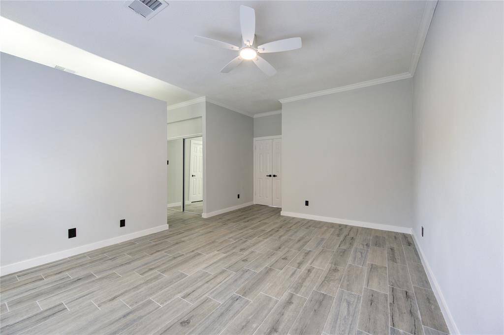 Conveniently located primary bedroom near the front entrance for easy access.