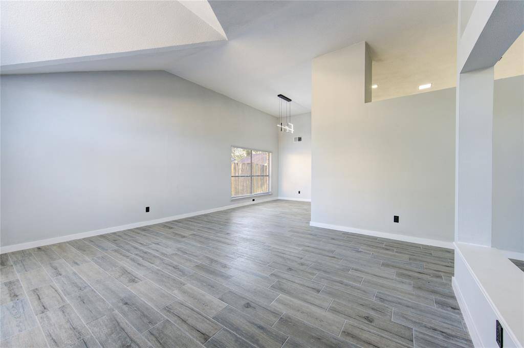 Spacious family room seamlessly flows into the inviting kitchen area.