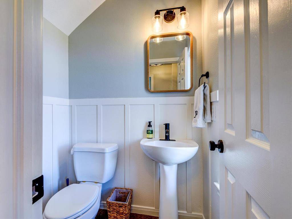 Beautifully decorated half bath downstairs located near the front door!