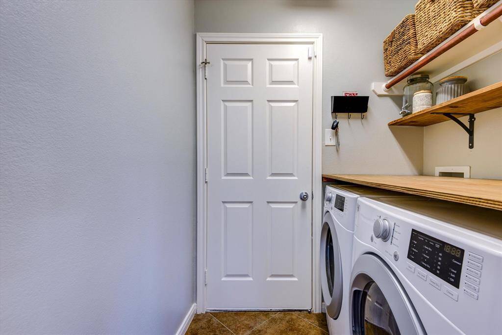 Laundry room is inside house! Handy folding table built over the appliances!