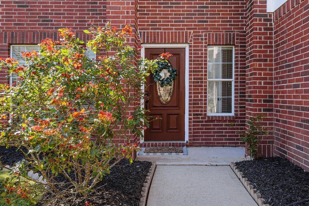 High entryway with lovely landscaping as you enter your new home!