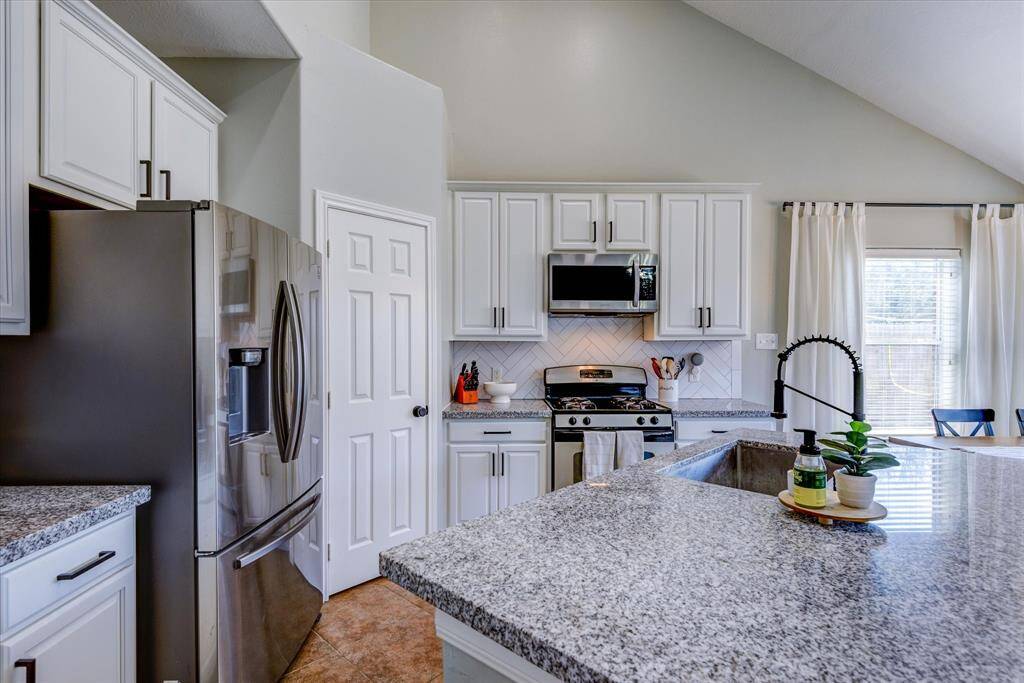 Massive kitchen island with space for cooking, homework or relaxing together!