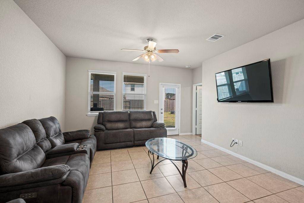 Side view of the living area which is completely tiled.