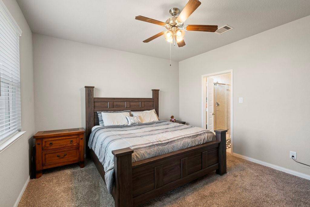 Another view of the primary bedroom.