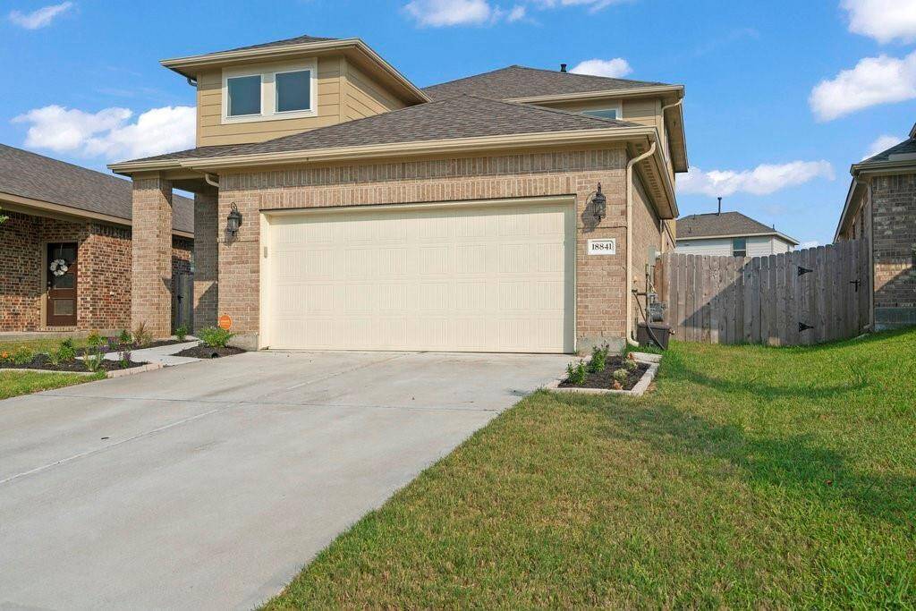 Two Car Garage with long driveway for extra parking space.