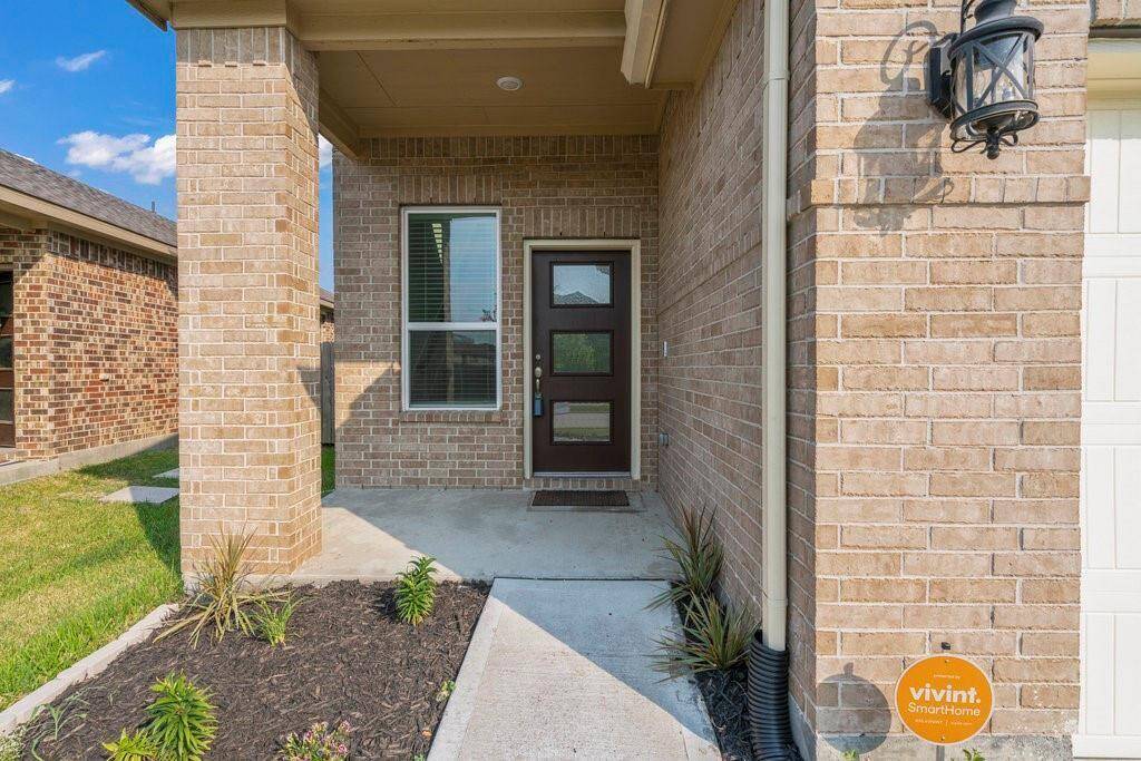 Gorgeous landscaped walkway to the front entry.