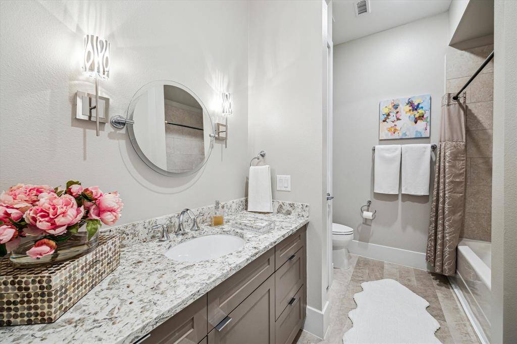 The second and third bedrooms share another well-appointed bathroom.