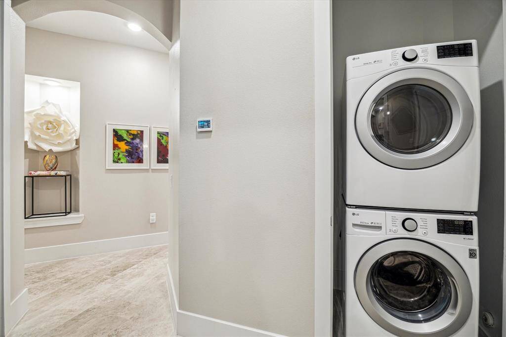A convenient and cleanly-designed laundry space.