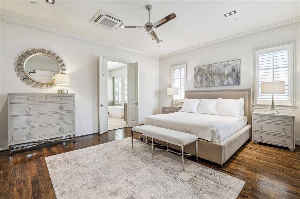 The pretty Primary Bedroom is located on the 2nd floor as are two secondary bedrooms. French doors open to this bedroom which is lovely.
