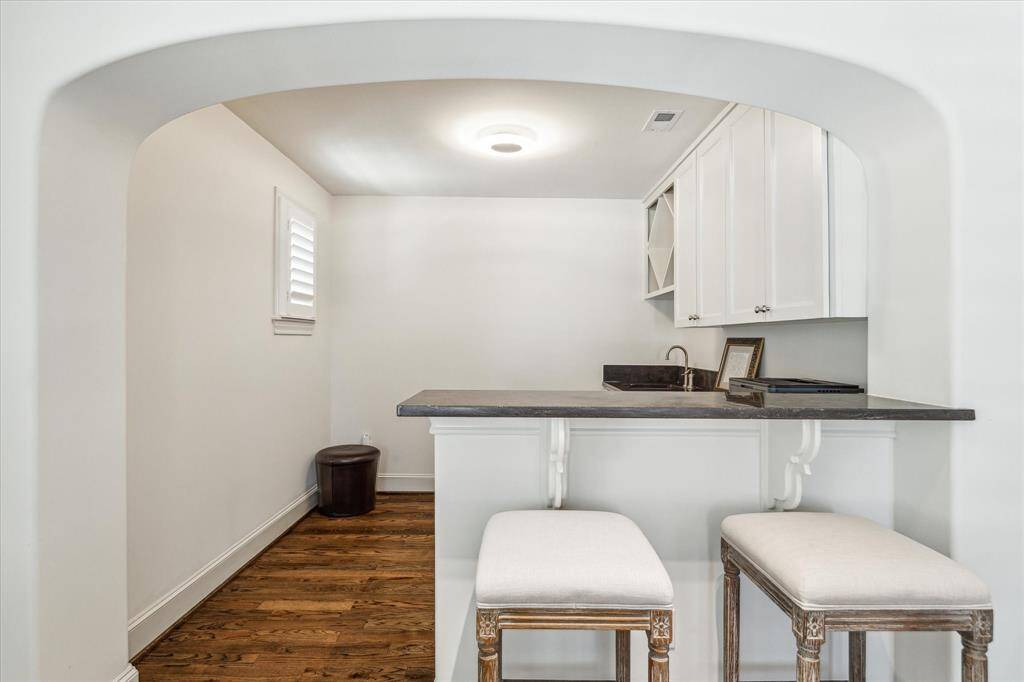The bar is a great addition to the space. Pop your popcorn, store your wine and beverages or make this your coffee bar.