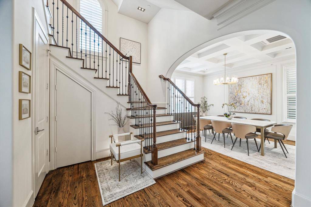 Formal Entry is impressive with high ceilings, gracious stairway, wood floors and so much natural light. The formal dining room and powder bath are located off the main entry.