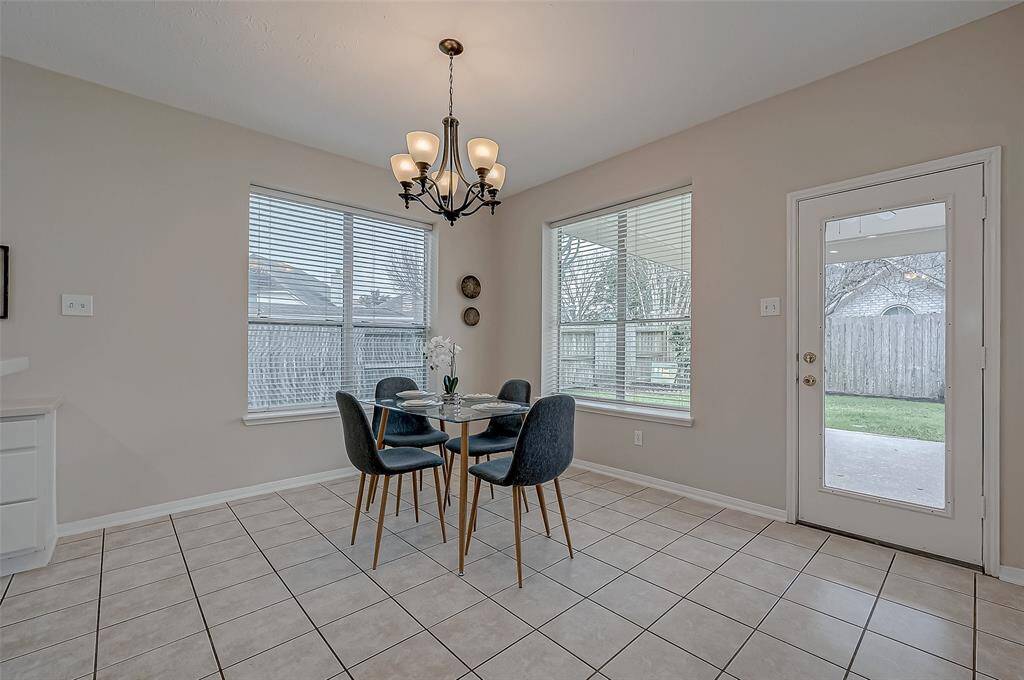 Start your mornings with a cup of coffee in this bright and airy breakfast room. Whether you're enjoying a casual breakfast or hosting a weekend brunch, the open layout keeps you connected to both the kitchen and the outdoor patio.