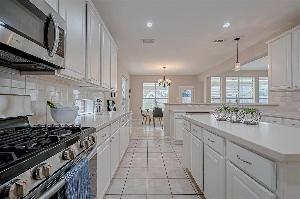 As the home chef, you’ll love the seamless connection between the kitchen and dining area, allowing you to prepare meals while staying engaged in every conversation. Whether you're cooking up a feast or simply grabbing a quick snack, the open layout keeps you connected to family moments, laughter, and gatherings.