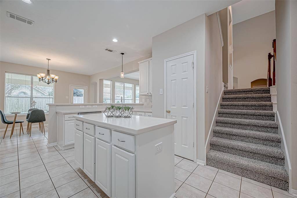 The inviting staircase leads you to a spacious upstairs retreat, where a fantastic game room and four comfortable bedrooms await, offering the perfect blend of fun and relaxation for your family.