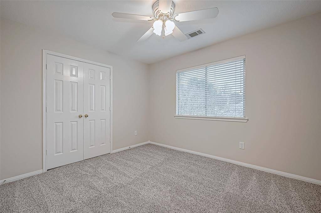 Nestled on the second floor, this inviting bedroom offers a peaceful retreat with soft natural light streaming through the window. The double doors provide convenient access to a spacious closet.