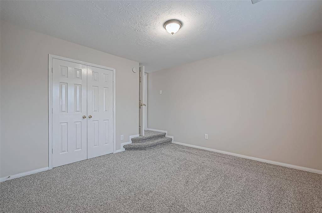 This bedroom offers a cozy retreat with its ensuite bathroom, adding a touch of character and privacy to your space. With a spacious closet and plenty of room to personalize, this is the perfect spot to unwind.