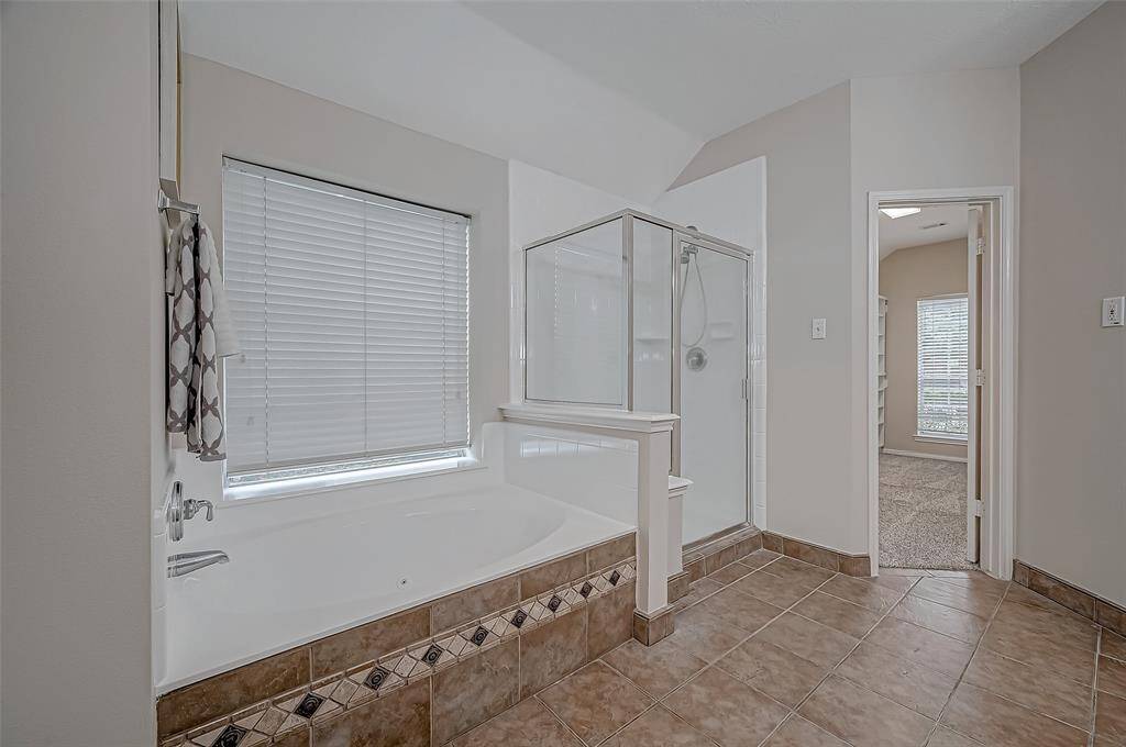 Imagine unwinding in your soaking tub, with natural light streaming in through the window, creating the perfect spa-like ambiance. Whether you're starting your morning with a peaceful soak or ending the day with a moment of relaxation, this bright and airy bathroom is designed for your ultimate comfort.