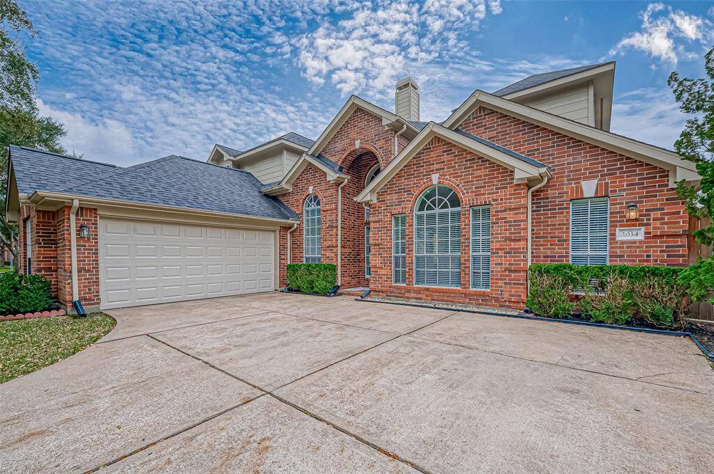 This spacious two-car garage provides plenty of room for your vehicles, extra storage, or even a handy workspace—giving you both convenience and versatility. The extended driveway offers ample parking for guests, making entertaining a breeze.