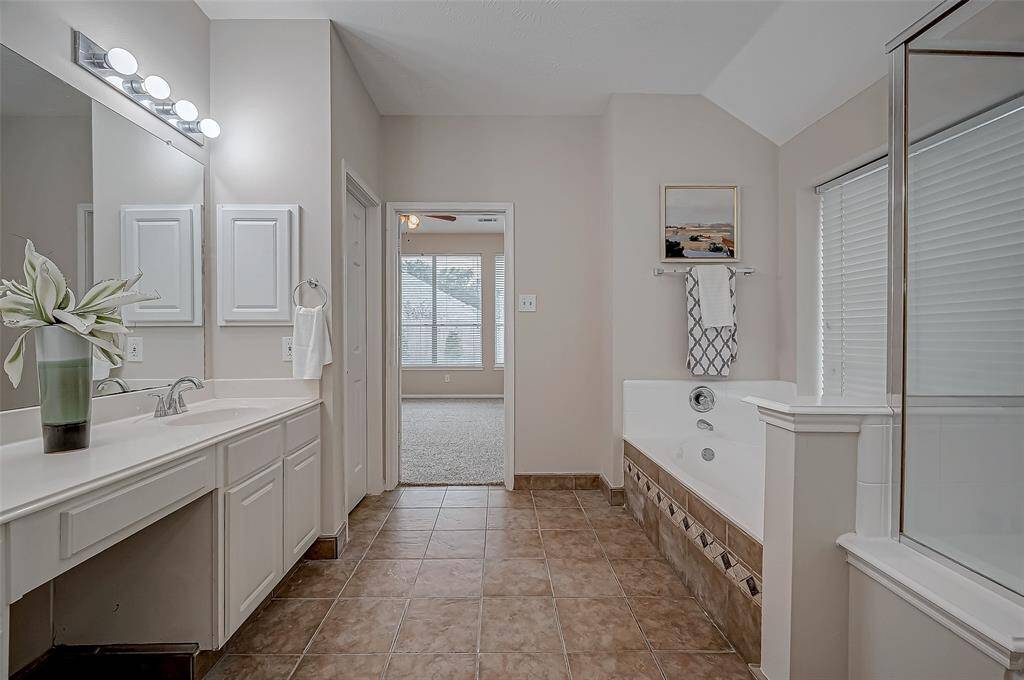From the luxurious double vanity to the relaxing soaking tub, every detail is thoughtfully placed to bring style and functionality together seamlessly.