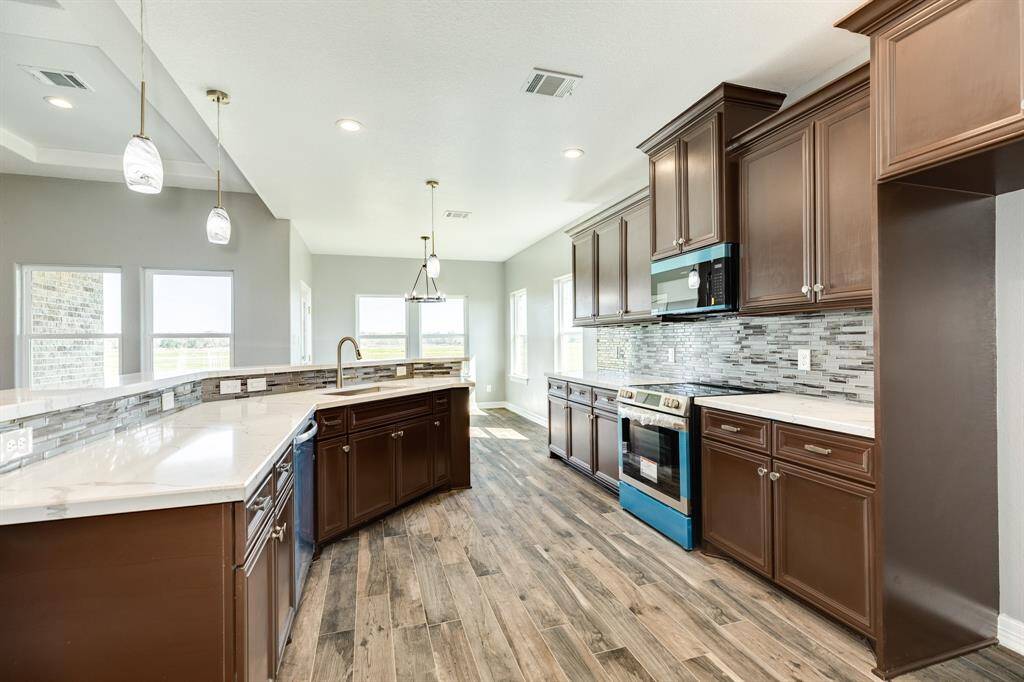Plenty of Cabinetry Made with Real Ash Wood and Door and Handle Hardware