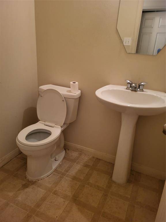 Powder Room with Pedestal Sink and toilet