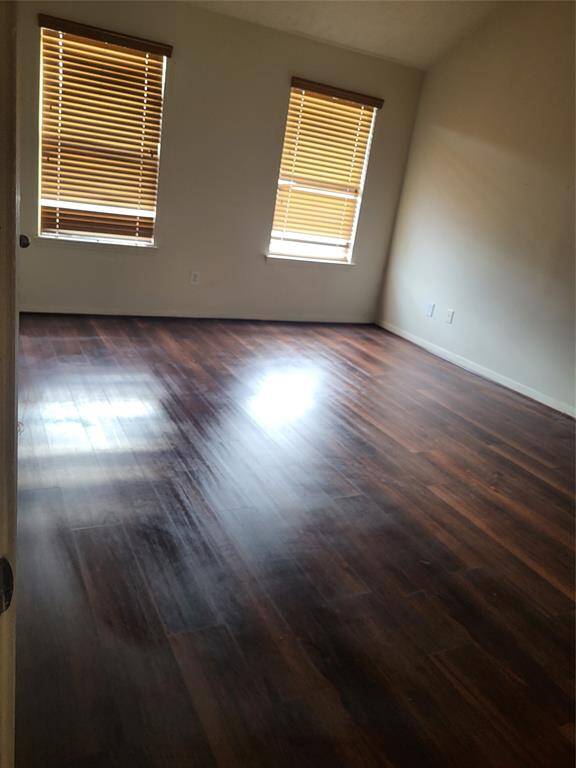 Large Primary Bedroom downstairs w/beautiful wood floors