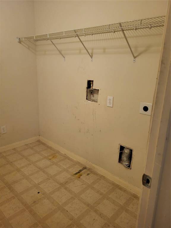 Laundry room plenty of room for full size appliances and storeage