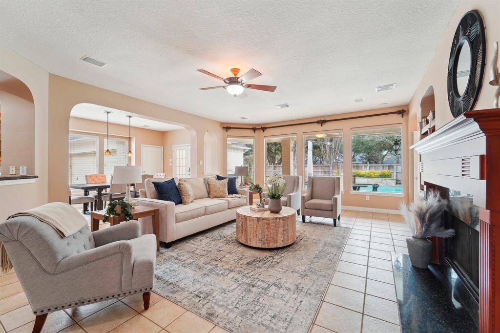 This beautiful family room offers the perfect setting to gather with loved ones or enjoy a peaceful evening at home. With its open layout and inviting ambiance, it’s a space designed for both lively conversations and quiet moments of relaxation.