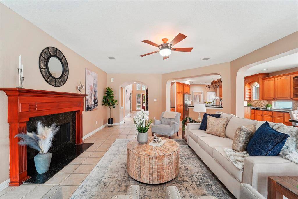 Imagine the sounds of chatter and laughter filling this wonderful family room, where memories are made with the ones you love most. With its inviting ambiance and open floor plan, this home is the perfect place to do just that.