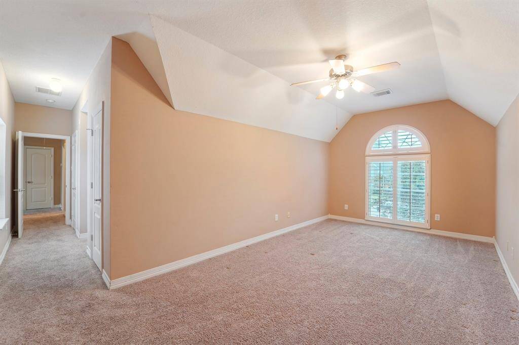 A wonderful perspective of this unique bedroom, featuring two closets for added storage and convenience.