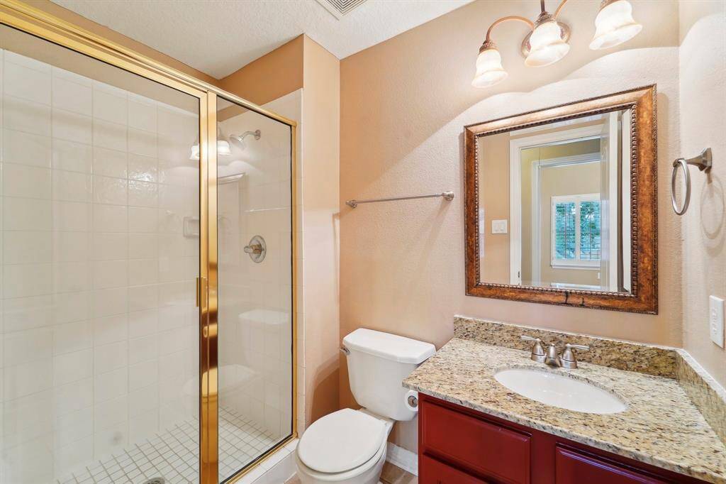 With two full bathrooms upstairs, morning routines should be relatively easy. This bathroom offers a single sink vanity with a full mirror and vanity lights above plus a full walk-in shower. The second full bathroom upstairs offers a full tub/tile enclosure.