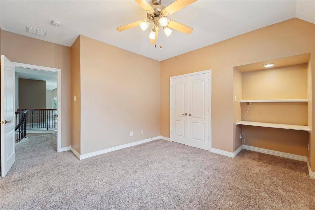 This roomy bedroom offers plenty of space for furniture, games, toys, and more.