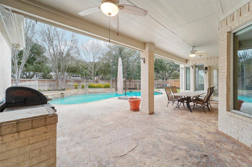 Whether you're hosting lively gatherings or unwinding after a long day, this backyard paradise is the perfect retreat. Enjoy a covered patio with a table and chairs that stay, a sparkling pool and relaxing spa, and a BBQ pit (included!)—perfect for grilling up some delicious outdoor burgers.