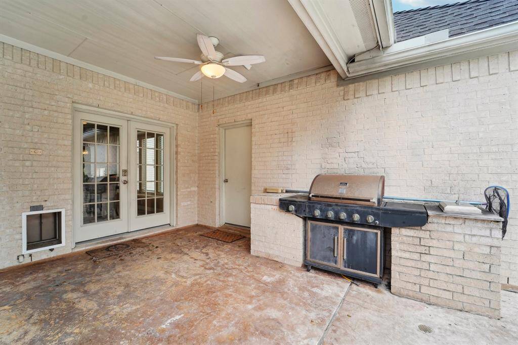 The covered patio is perfect for seamless outdoor entertaining, featuring a built-in brick grilling station for effortless summer BBQs. Stylish patio doors add charm, while a dedicated pet entrance ensures easy access for your dog or cat. Plus, enjoy the convenience of the oversized two-car garage, complete with a pegboard and work table—both staying for your projects and storage needs.