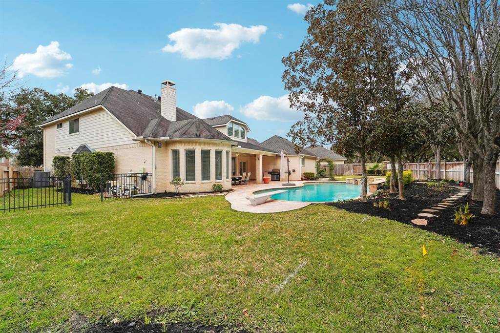Truly spectacular! This oversized cul-de-sac lot spans more than a quarter of an acre, offering separately fenced side yards, a glistening in-ground pool and spa, and a vibrant lawn framed by mature landscaping. An automated sprinkler system ensures effortless upkeep, making this outdoor haven as practical as it is beautiful. Your private retreat is ready to enjoy!