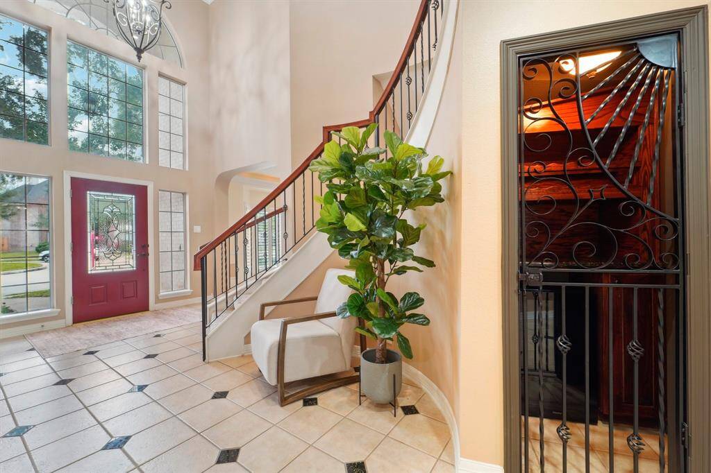 A true showpiece of the home, the exquisite wine grotto is gracefully tucked behind an ornate iron gate. Inside, rich wood shelving offers a sophisticated display for your collection, while a built-in wine chiller keeps your favorite vintages perfectly tempered for any occasion.