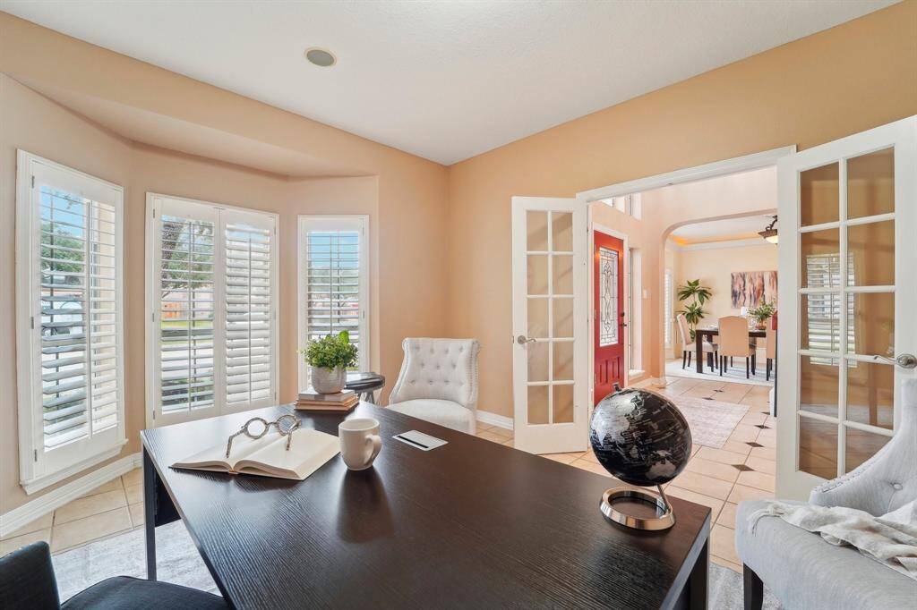 Glass French doors at the study offer the perfect blend of style and function, providing the privacy you need for morning calls, virtual meetings, or online classes.