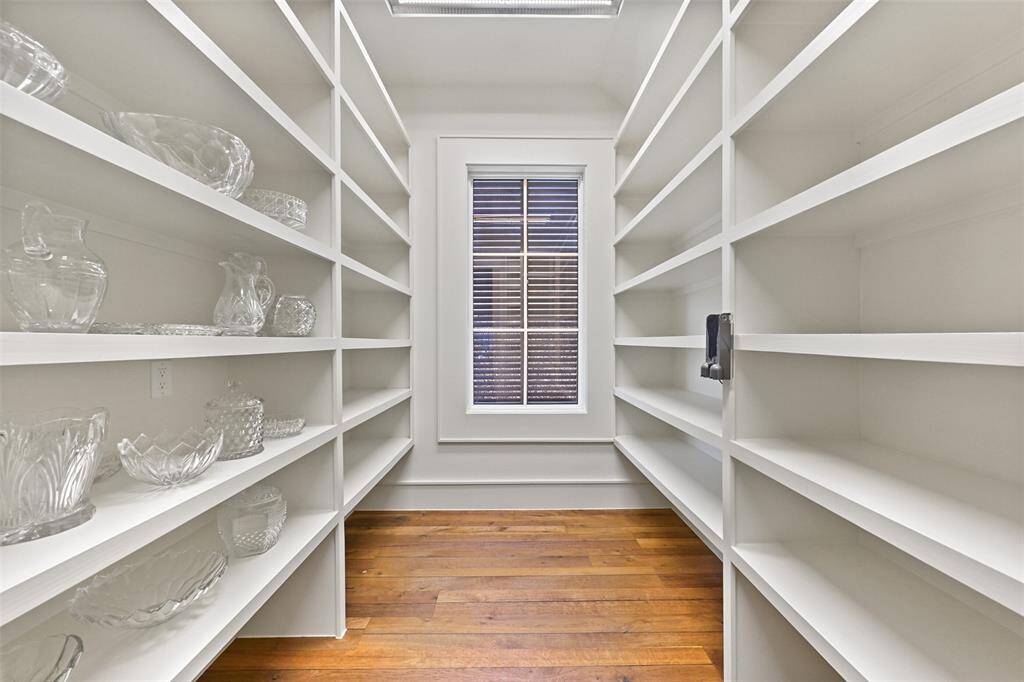 A large, expansive pantry hosts great size and versatility to store all of your spices, dry goods & more.