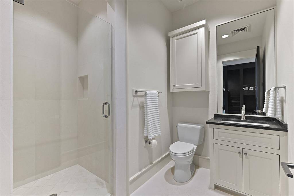 The Bunk room or Bedroom 3 also boats it's own private ensuite bathroom with walk-in shower, vanity and additional cabinetry overhead.