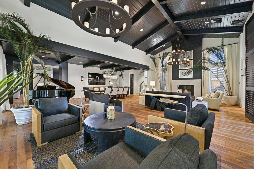 Striking views of the great room leading into the formal dining room. An exception opportunity for luxury living and impeccable entertaining.