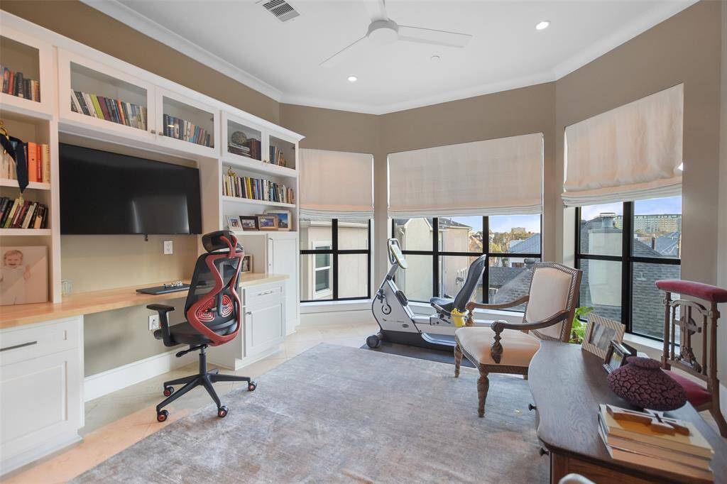 A wall of built-ins accents the study/library. This versatile room has been used for multiple purposes by different owners.