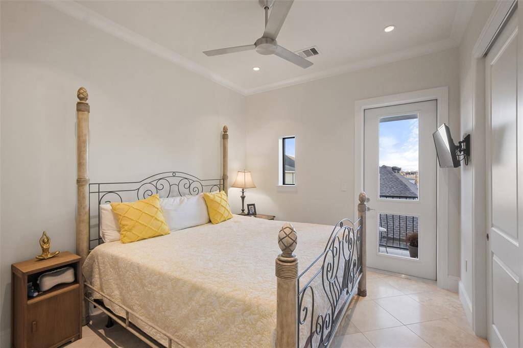 This secondary bedroom has a step out balcony, ensuite bath and large closet.