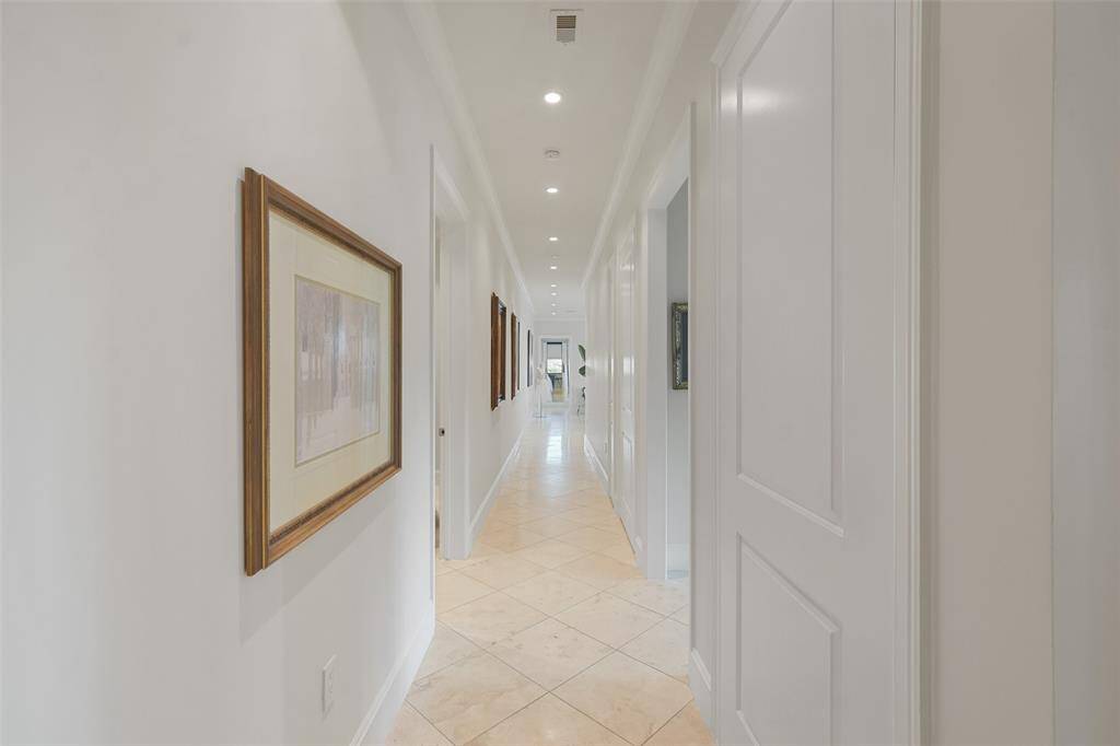 The hallway to the main living area features two large storage closets and a silver cloth lined storage space.