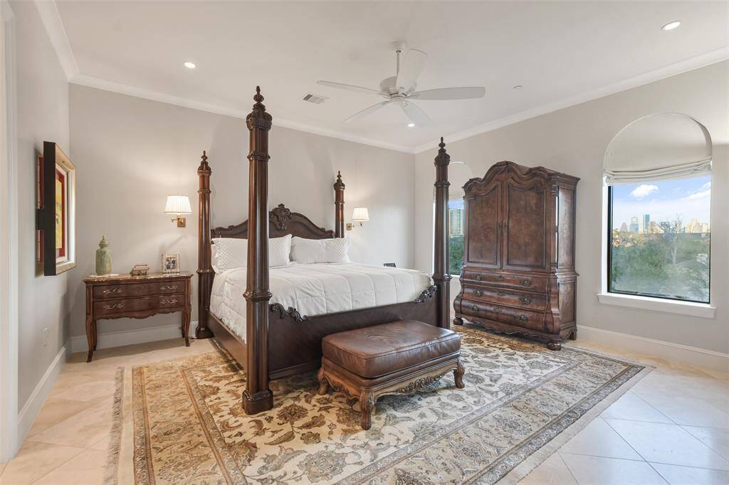 The primary bedroom has ample space for a king sized bed and nightstands as well as additional space for a sitting area.