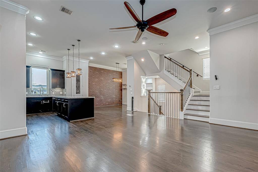 2nd Floor Loving. A Modern Layout Featuring a large living room, dining area, and a sleek kitchen, all seamlessly integrated.