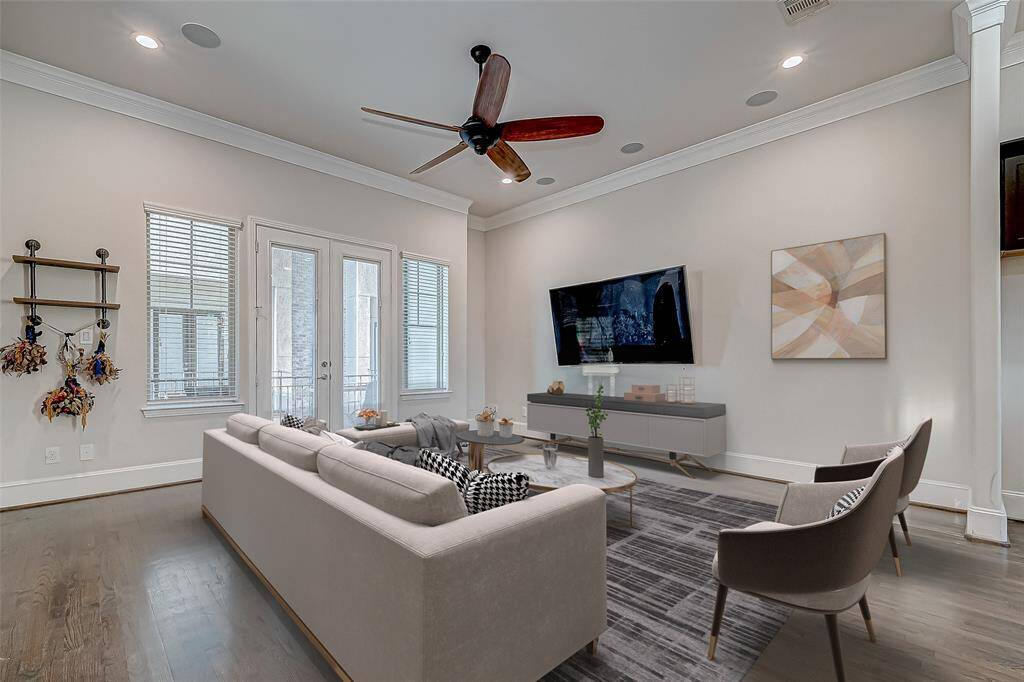A Modern Layout Featuring a large living room, dining area, and a sleek kitchen, all seamlessly integrated.. Virtually staged