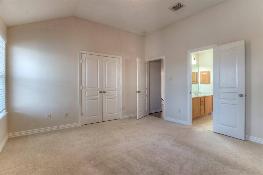 One of the bedrooms upstairs with a view of the lake.
