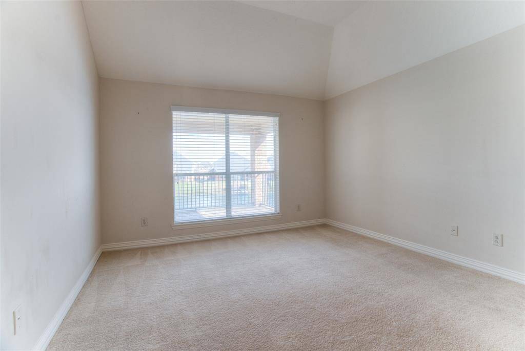 This is the other bedroom located on the second floor with a view of the lake.